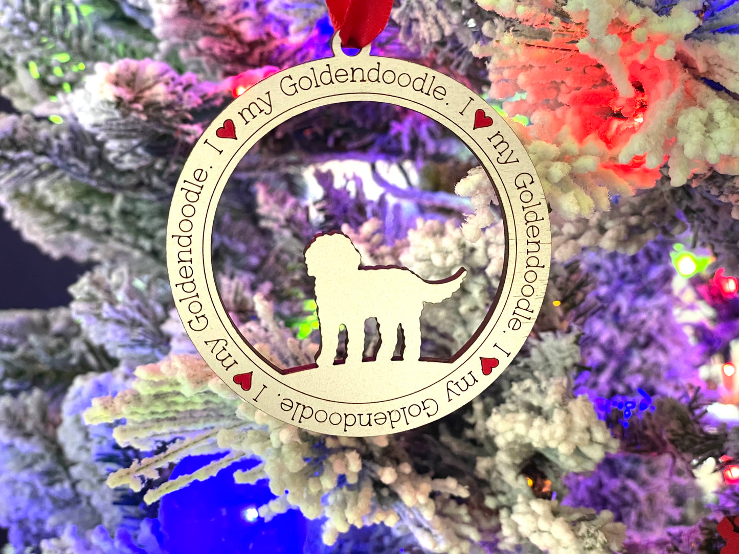 I love my golden doodle dog ornament hanging on Christmas tree.