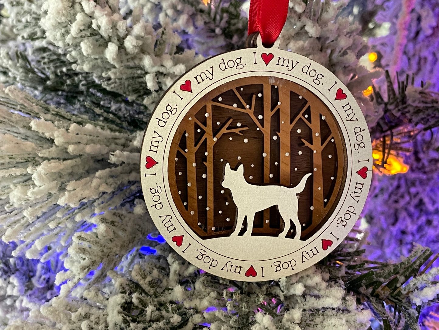 I love my dog ornament hanging from Christmas tree.