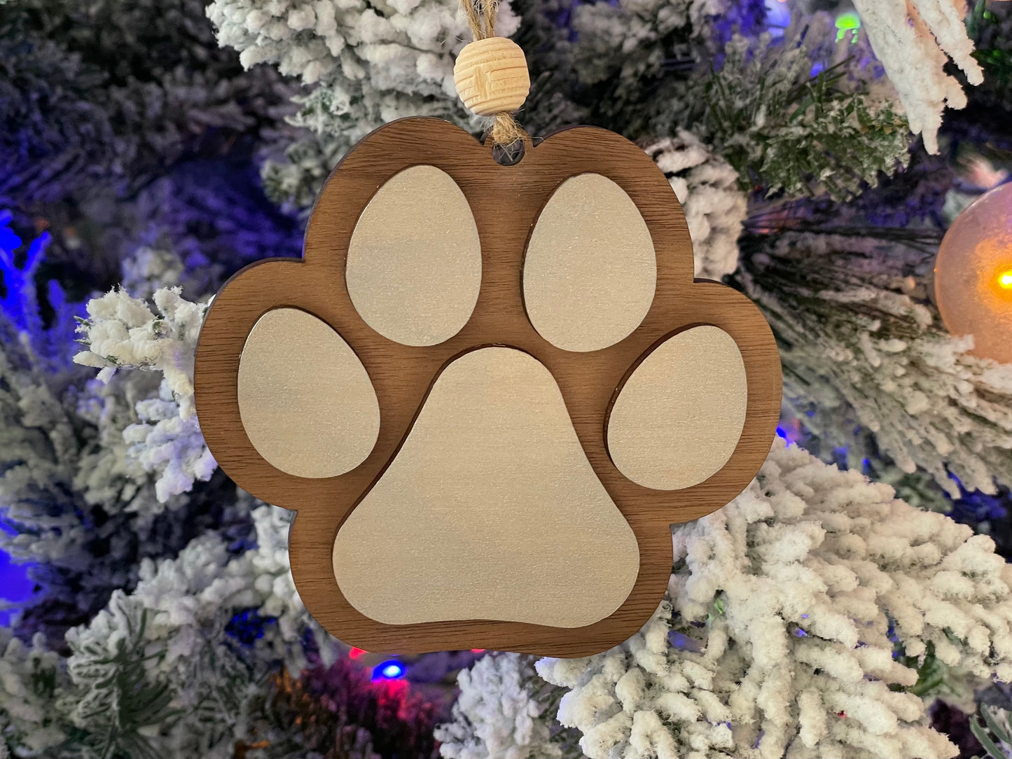 Wooden Dog Paw hanging on Christmas Tree.