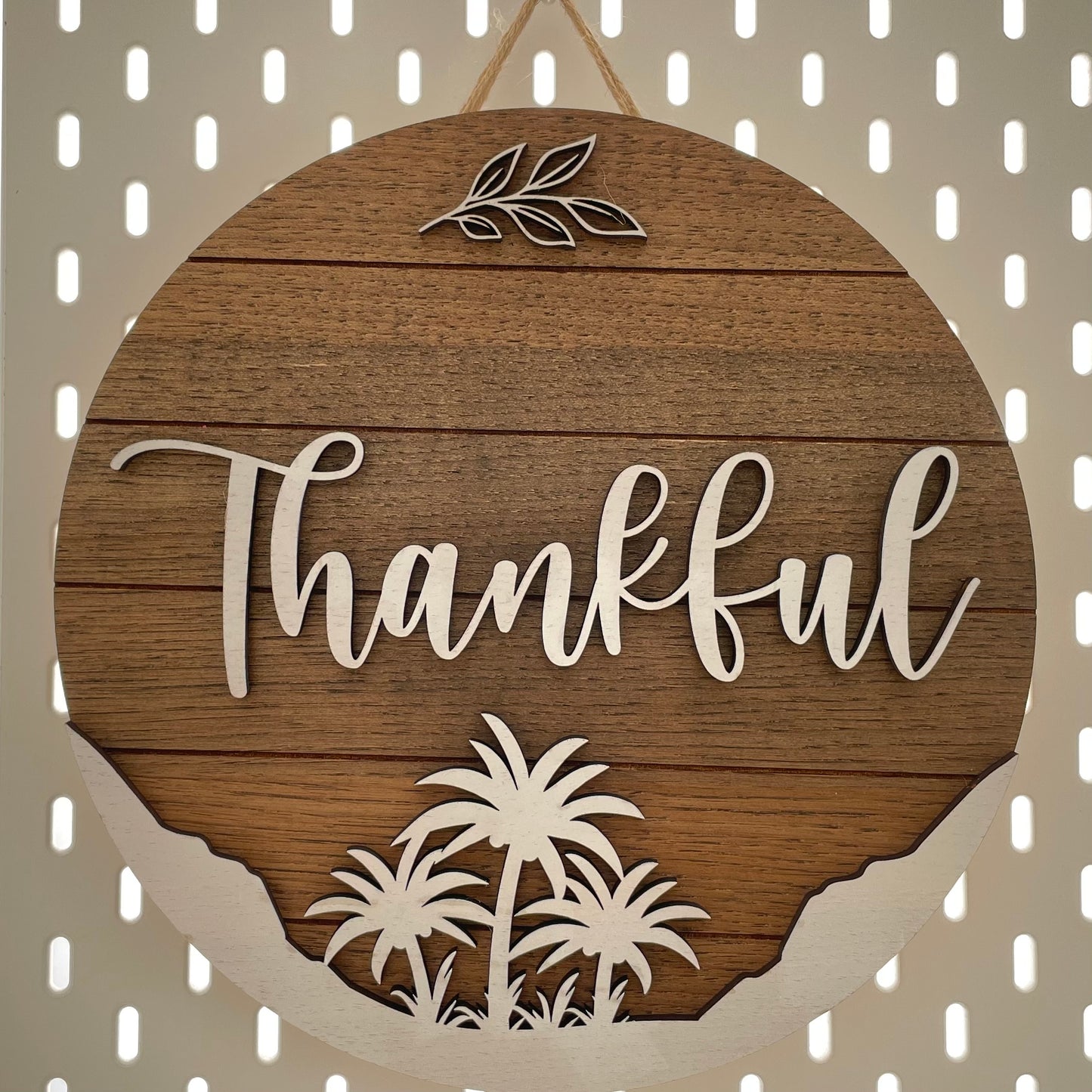 Large round sign saying "Thankful" hanging.