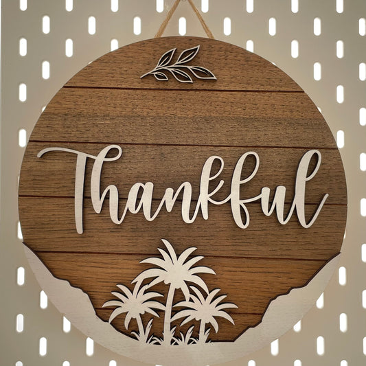 Large round sign saying "Thankful" hanging.